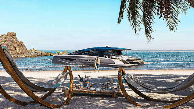 Luxury power catamaran anchored near a sandy beach with hammocks in the foreground and palm trees framing a tranquil seaside scene